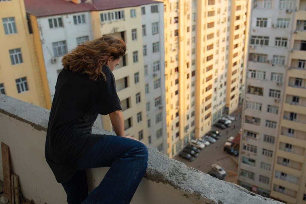 Stressed girl climbs balcony and wants to suicide